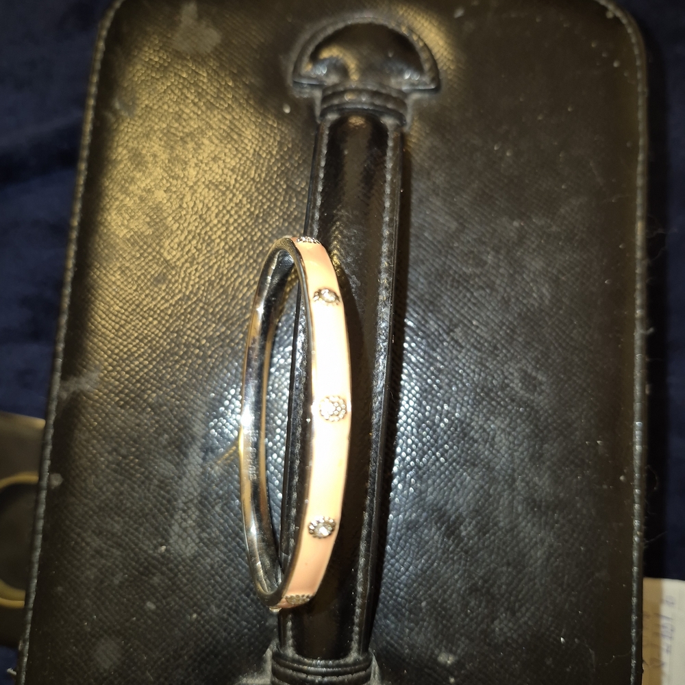 Elegant Gold and Silver Bangle with Gem Accents